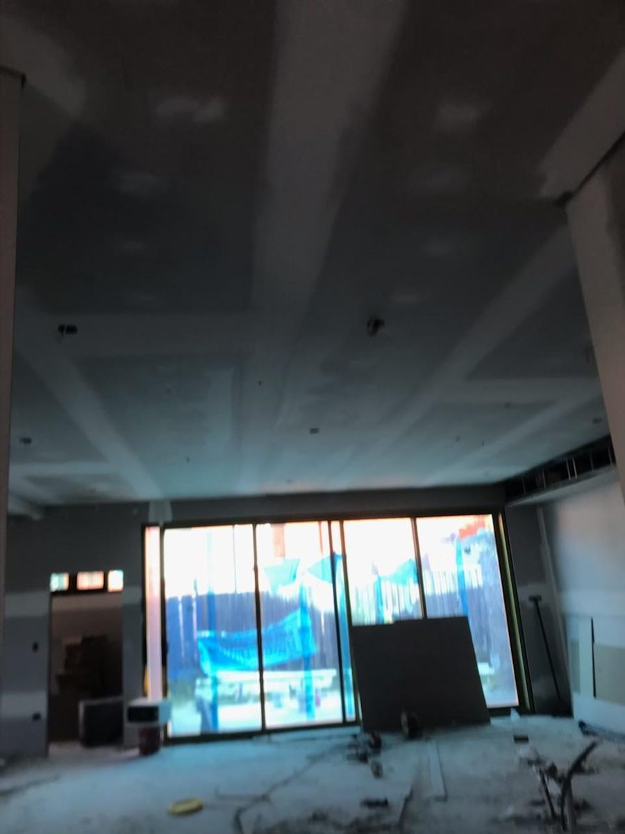 Ceiling set and coated above a shopfront opening with the fit out beyond