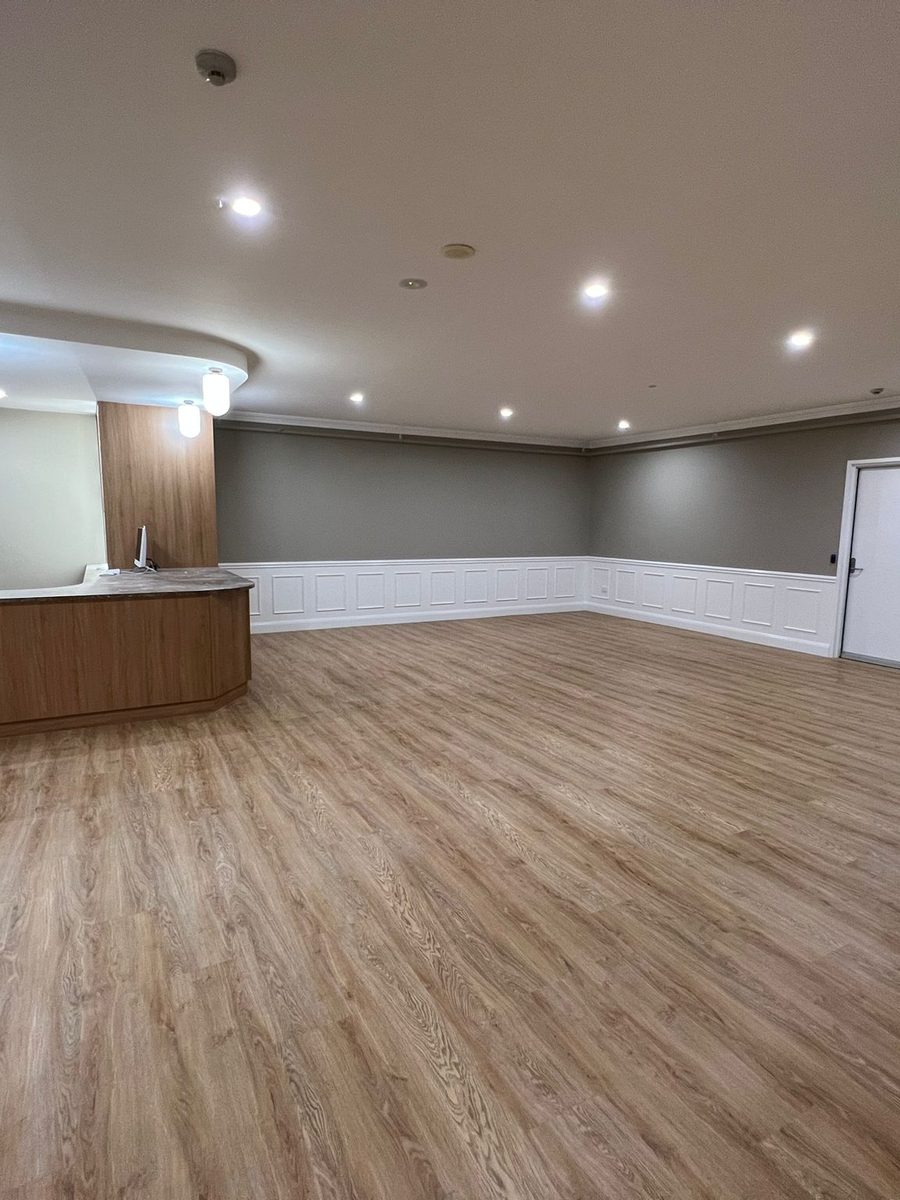 Function room finished with a curved ceiling detail, a panelled dado and new flooring