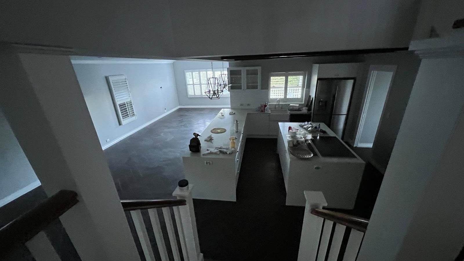 Kitchen and living area with the walls and ceiling set and painted and the joinery installed