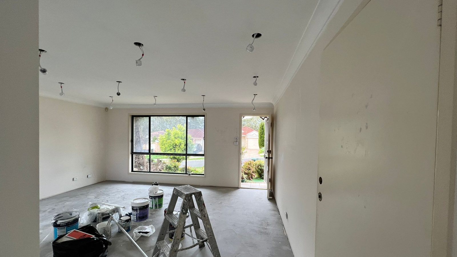Room set and painted with the cornice run and a ladder still standing before the fit out