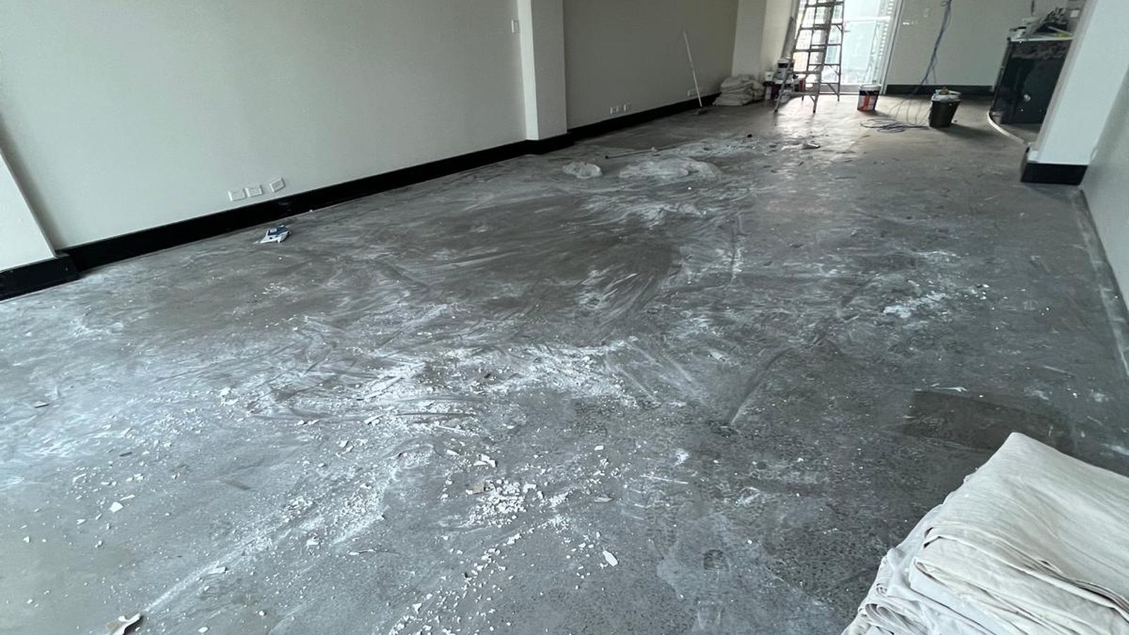 Empty tenancy with the walls set and the floor cleared ready for the next trade